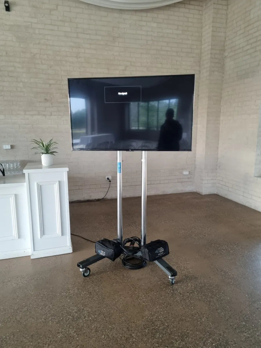 TCL 165cm (65”) 4K Mini-LED QLED TV on mobile stand at event venue