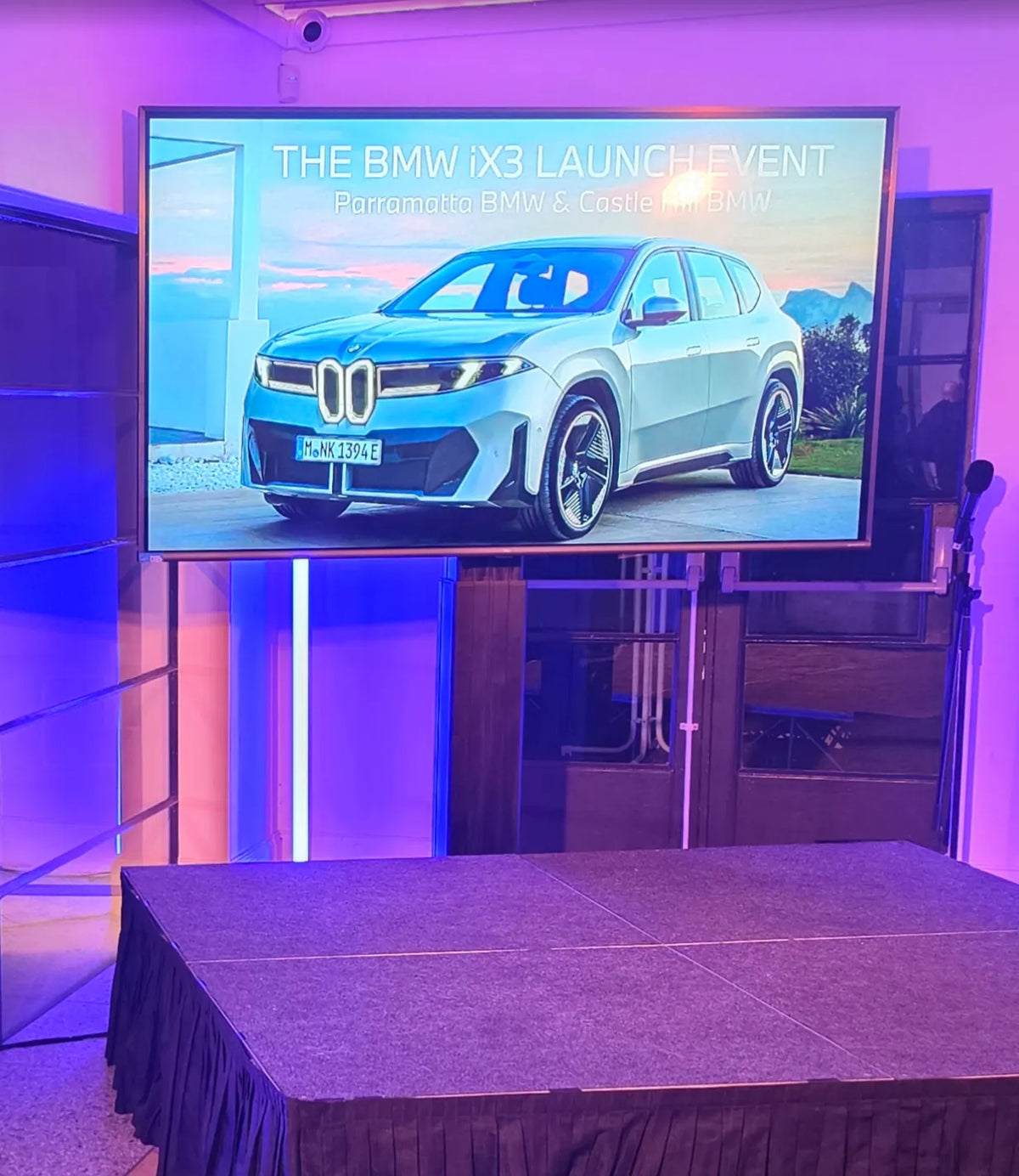 TCL 85" (216cm) 4K LED LCD TV on stand at BMW launch event